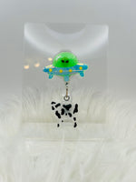 Alien Badge Reel with cow moving up and down/