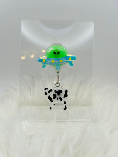 Alien Badge Reel with cow moving up and down/